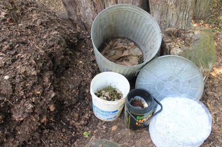 As my pile matures, new raw materials go into a garbage can -- a base of sycamore bark, shredded paper, food scraps and a dollop of compost...